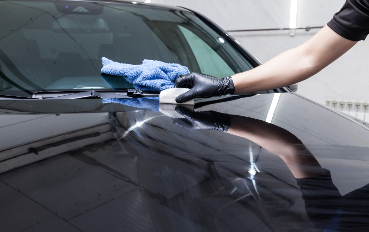 Ceramic coating application on a black car