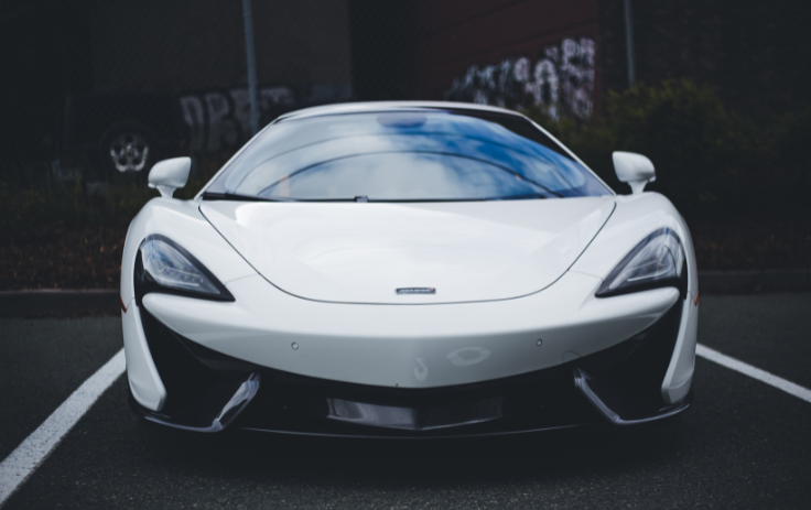 clean white car parked outside